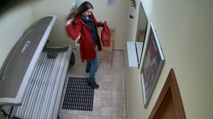 Leggy brunette in tight jeans undresses her red coat - Picture 8
