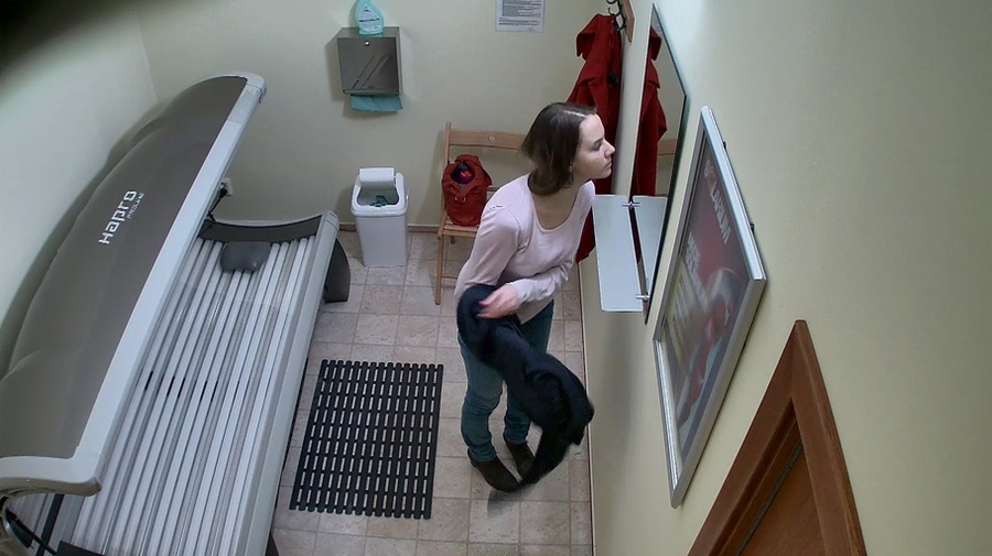 Leggy brunette in tight jeans undresses her red coat - XXXonXXX - Pic 9