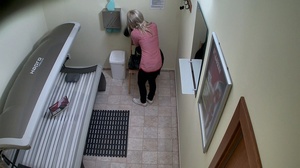 Shiny blonde takes off pink shirt and black pants - Picture 1