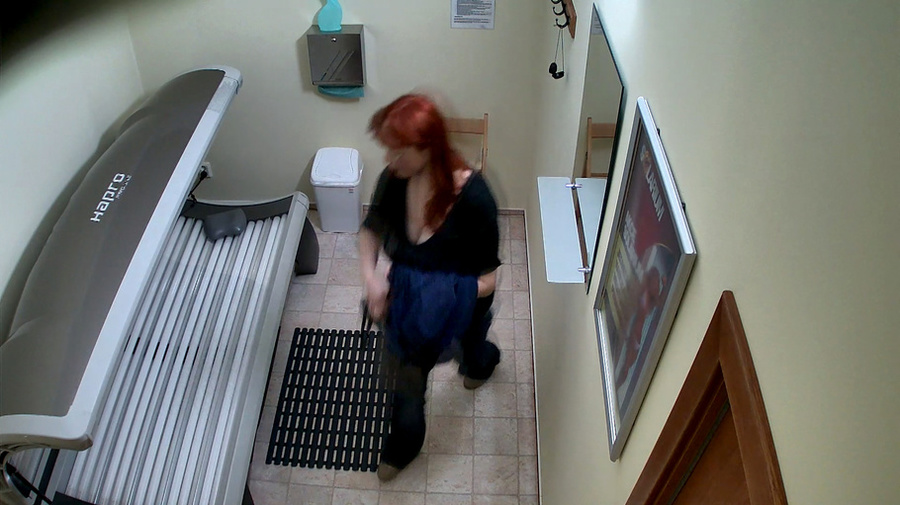 Busty redhead woman takes off her black outfit in solarium - XXXonXXX - Pic 8