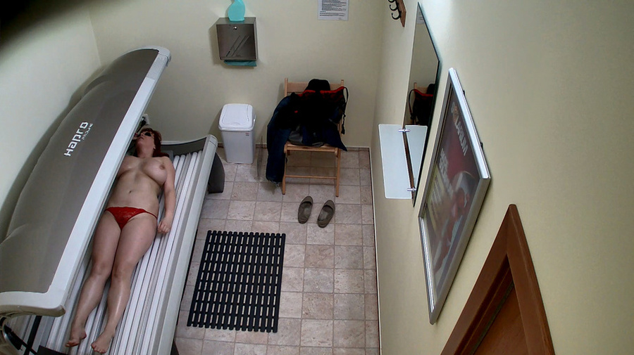 Busty redhead woman takes off her black outfit in solarium - XXXonXXX - Pic 9