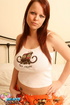 Tempting redhead in orange PJ pants and white and black T-shirt shows