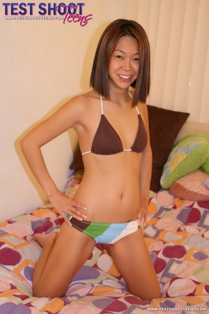 Slim sexy Asian brunette in colorful bik - Picture 2