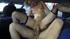 Tattooed blonde in stockings is giving a deep blowjob in the car