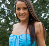 Brunette babe poses in the garden as she shows pussy and asshole.