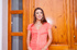 brunette pink dress kneels