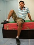 Hot Asian pose his skinny body on a green bed wearing his blue and white