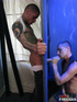 Tattooed dude in white shirt and jeans pose his hunk body before he shoots