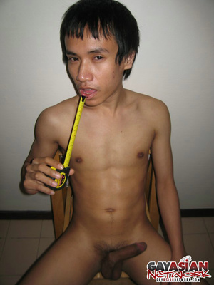 Asian stud takes off his gray shorts the - Picture 3