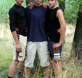Gorgeous boys take off their blue and their black shirts then pose their