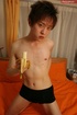 Hot Japanese displays his skinny body as he pose topless on an orange