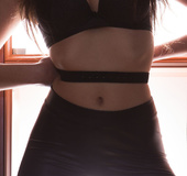 Cute brunette in black pants and top models hot ass and rubs cunt with