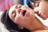 masseuse fingering brunette's ass