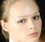 Chick in lace white gloves and scarf poses hot on brown couch