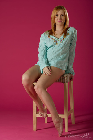 Redhead in a blue top displays her lovel - Picture 1