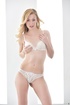 Slim curvy blonde in white lingerie teases with sexy small tits and hot