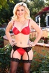 Tasty tattooed blonde in red lingerie and black pantyhose blows long dick