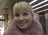 Ponytailed blonde teen in pink sweater handled in the train