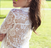Foxy brunette in a white mesh cropped top shows off her body pleasurably