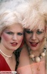 Allring blondes in red dress, stockings and high heels and in black and