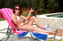Poised honey wets her white bikini in the pool and heads inside, seeking