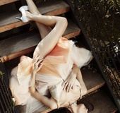 Pale skin brunette in tulle dress showing fully shaved and tiny peach