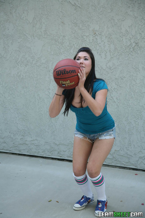 Black-haired brown-eyed Japanese beauty with nose ring plays basketball, gives blowjob - Picture 2
