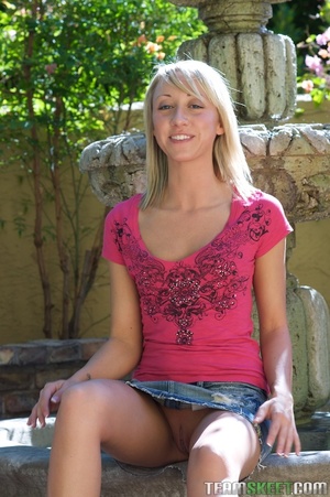 Flat-chested blonde goes without panties in a garden to show off her assets - XXXonXXX - Pic 2