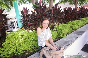 Captivating blue-eyed brunette shows what she has in public, more on the sheets - Picture 1