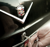 Ash-blonde, brown-eyed seductress with black classic car takes lovers