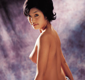 Brown-eyed Japanese beauty in corset seduces in the shower and on the