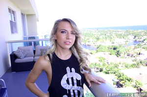 Blue-eyed blonde whore in black tanktop  - Picture 1
