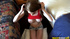 Long haired busty brunette in red top and jeans shorts undressing and