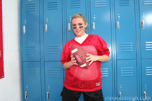 Naughty blonde in her red sports uniform - Picture 1