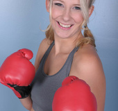 Pretty blonde with curvy body in boxing gloves strips and gets her pussy