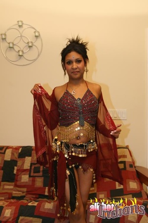 High heeled indian gal sheds her red outfit and exposing her tits and shaved snatch on the couch - XXXonXXX - Pic 2