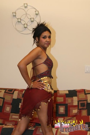 High heeled indian gal sheds her red outfit and exposing her tits and shaved snatch on the couch - XXXonXXX - Pic 3