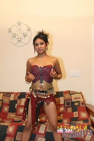 High heeled indian harlot in sexy outfit and black panty stripteasing and flashing her coochie on the sofa - XXXonXXX - Pic 7
