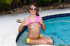 Small brunette in pink and yellow bikini sucks big cock outdoors and fucks