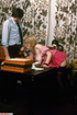 Lusty secretary with stunning body in pink dress, black stockings and