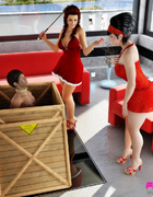 Twp women in red find a guy to be their man servant.