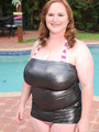 Fat redhead takes off her black dress - Picture 1