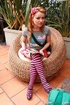 High heeled teen in striped socks took off her black bra and enjoying