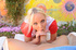showy blonde wearing coral