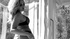 Amazing blonde in black gets in bed to fuck a stud.