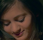 Hottie lets oil drip down her body right to her naked pussy lips