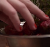 Barefoot redhead with chubby tits seductively eats strawberries in floral