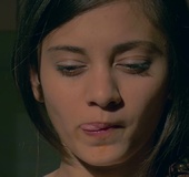 Short haired brunette uses shows off tongue skills by cradling olive oil