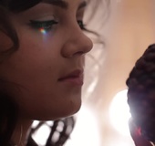 Tiny brunette has fun playing with herself on a brown couch