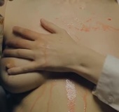 Video of a cute young babe pouring red wine over her nice tits